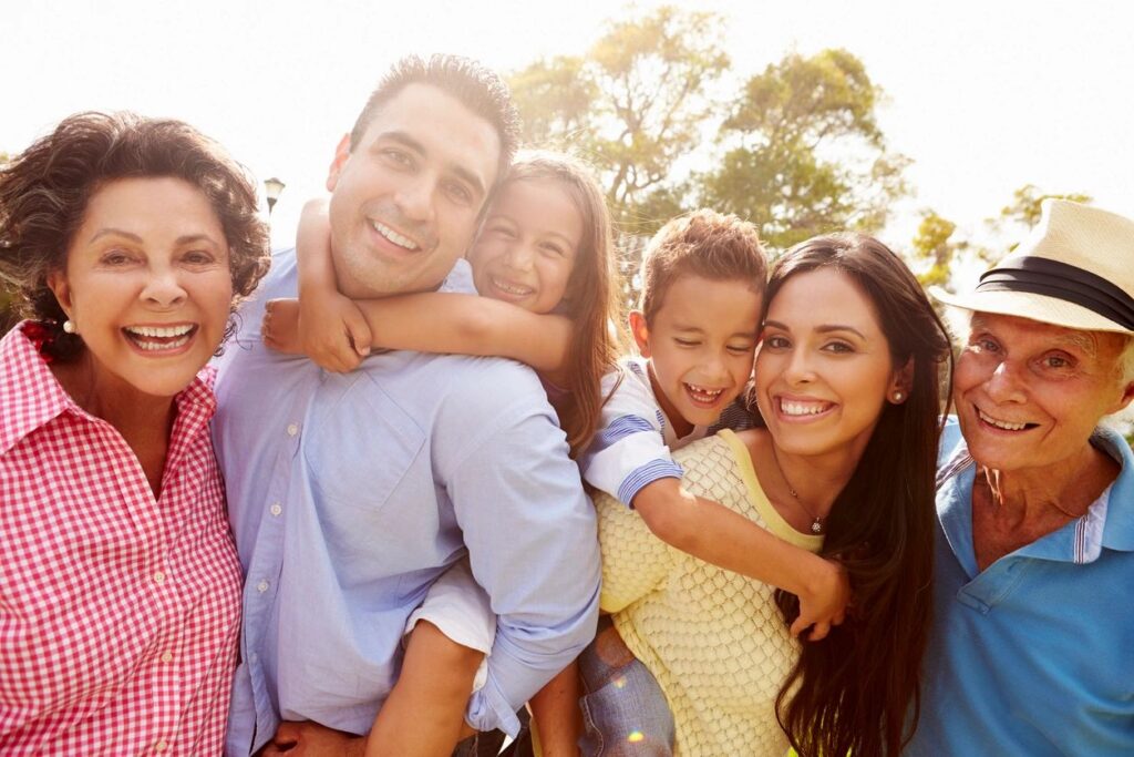 happy outdoor family portrait with grandparents. parents, and children