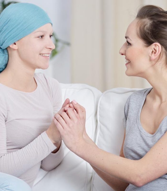 Young woman supporting her friend having cancer